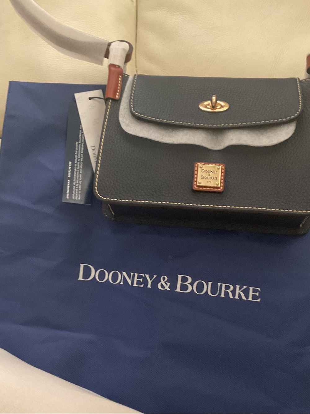 Dooney & Bourke Navy blue Pinky bag.Leather Turnlock Crossbody